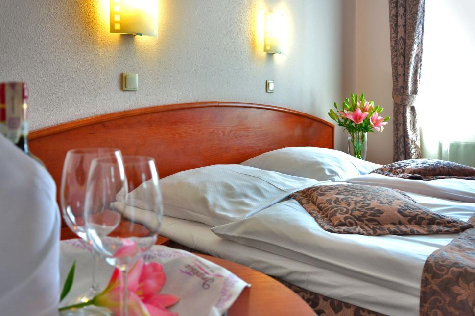 cozy-hotel-room-with-flowers-and-modern-lighting-setup..jpg