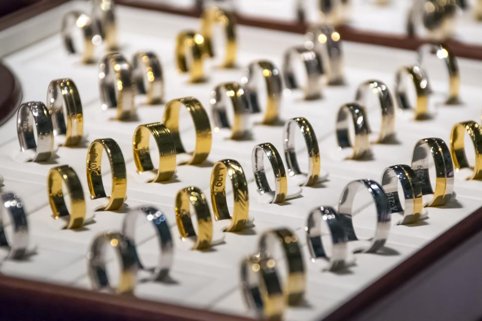 Free Image of Display of gold and silver rings in a jewelry store. 