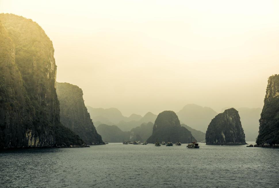 Free Image of Scenic view of water surrounded by large rock formations. 