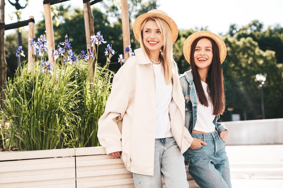 Free Image of Two happy young women relaxing outside 