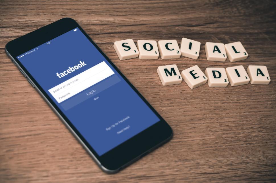 Free Image of Smartphone with Facebook open and SOCIAL MEDIA tiles. 