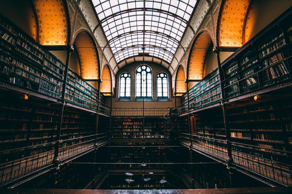 Free Image of Elegant interior of a classical library with bookshelves. 