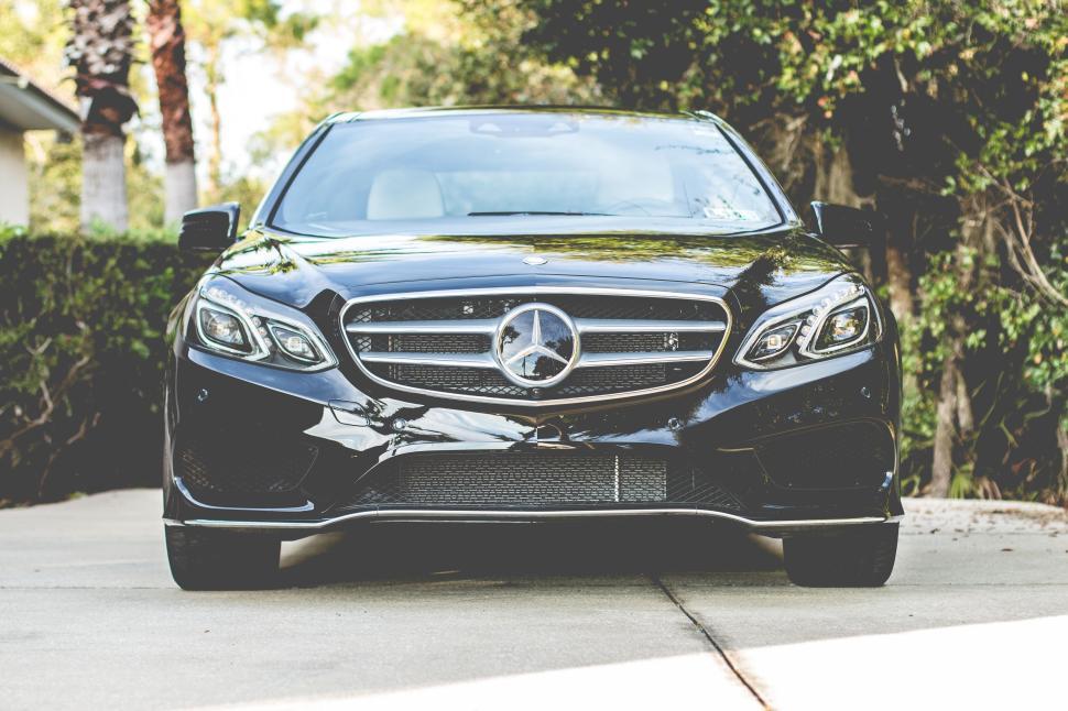 Free Image of Black luxury Mercedes parked on concrete driveway 