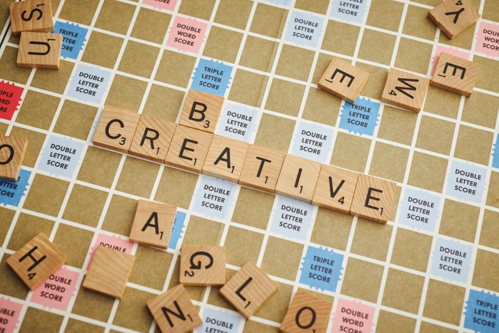 Free Image of Wooden tiles on a board spelling out  BE CREATIVE 
