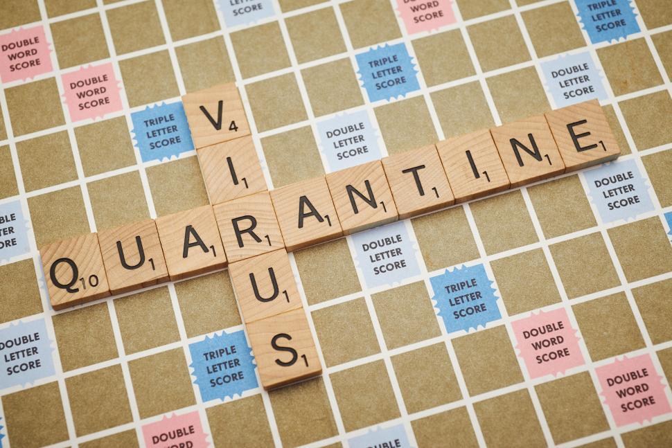 Free Image of Scrabble tiles spell  QUARANTINE  and  VIRUS  on a board. 