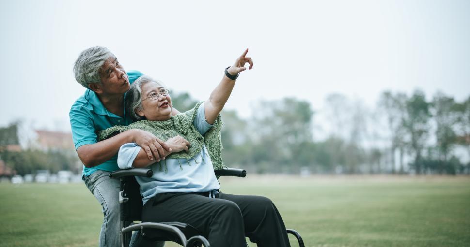 mature-asian-couple-relax-with-happy-in-park.jpg
