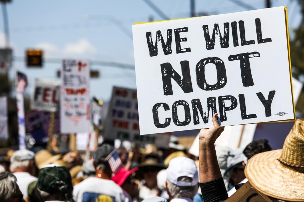 Free Image of Hands off protest against Donald Trump in the United States calling for compliance change 