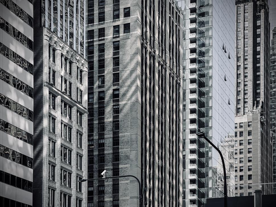 Free Image of Texture of tall urban architecture contrasts in black and white in buildings of downtown Chicago, Illinois 