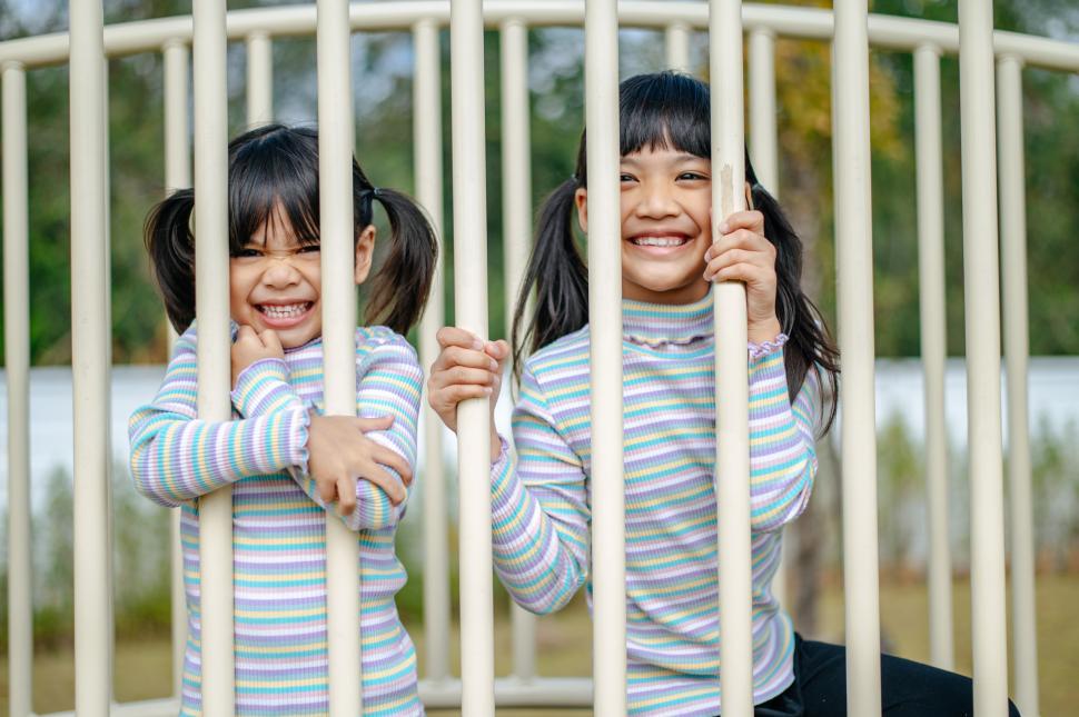Free Image of two girls playing in the playground. 
