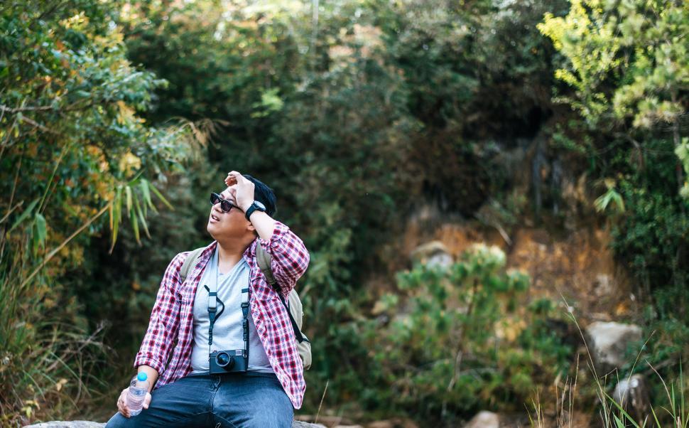 Free Image of Young travel man relaxing after hiking and taking a break 