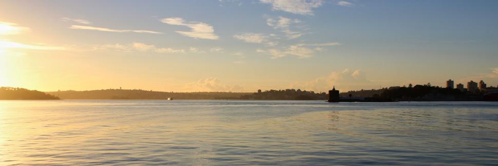 Free Image of Calm evening view overlooking smooth, reflective river. 