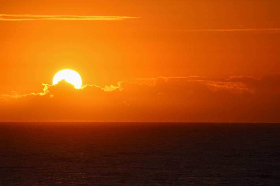 Free Image of Stunning sunset over ocean with golden hues image. 