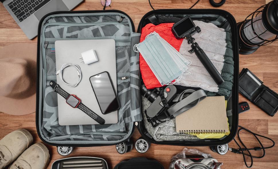 Free Image of Top view of Preparing suitcase for summer vacation trip 