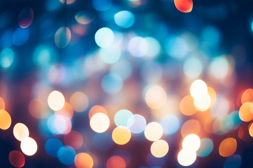 Free Image of Colorful bokeh lights create a festive atmosphere at night 