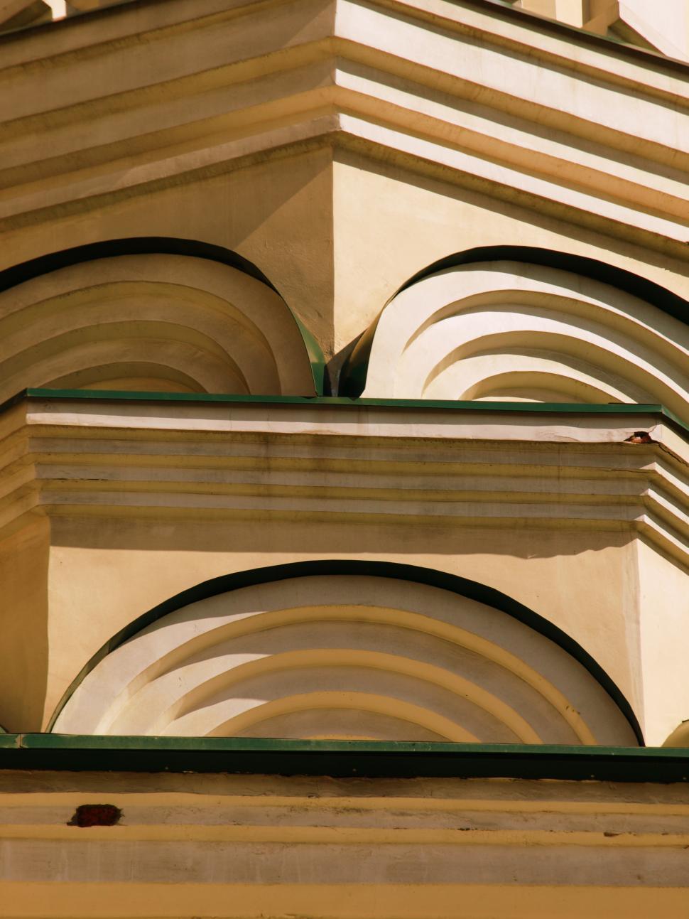 Free Image of Architectural details of an ornate building captured in sunlight on a clear day 