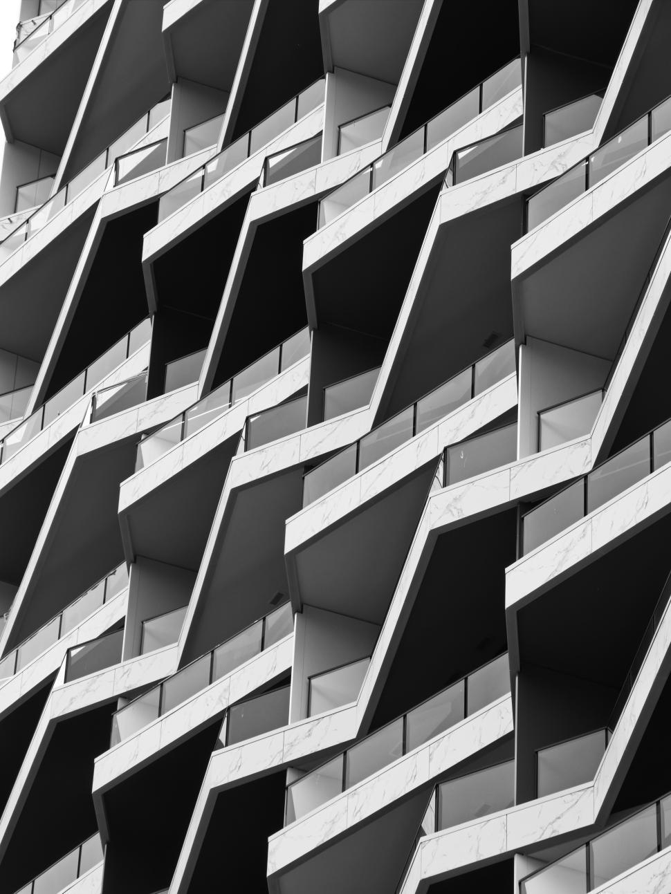 Free Image of Modern architectural design featuring unique balcony structures in urban setting 
