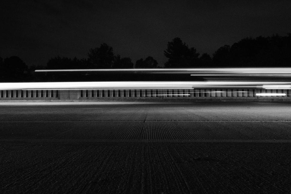 Free Image of Nighttime city streets captured in stunning light trails and shadows 
