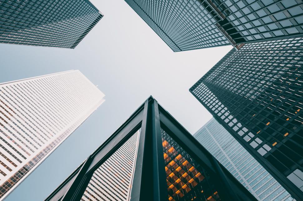 Free Image of Modern skyscrapers viewed from ground level in a city 