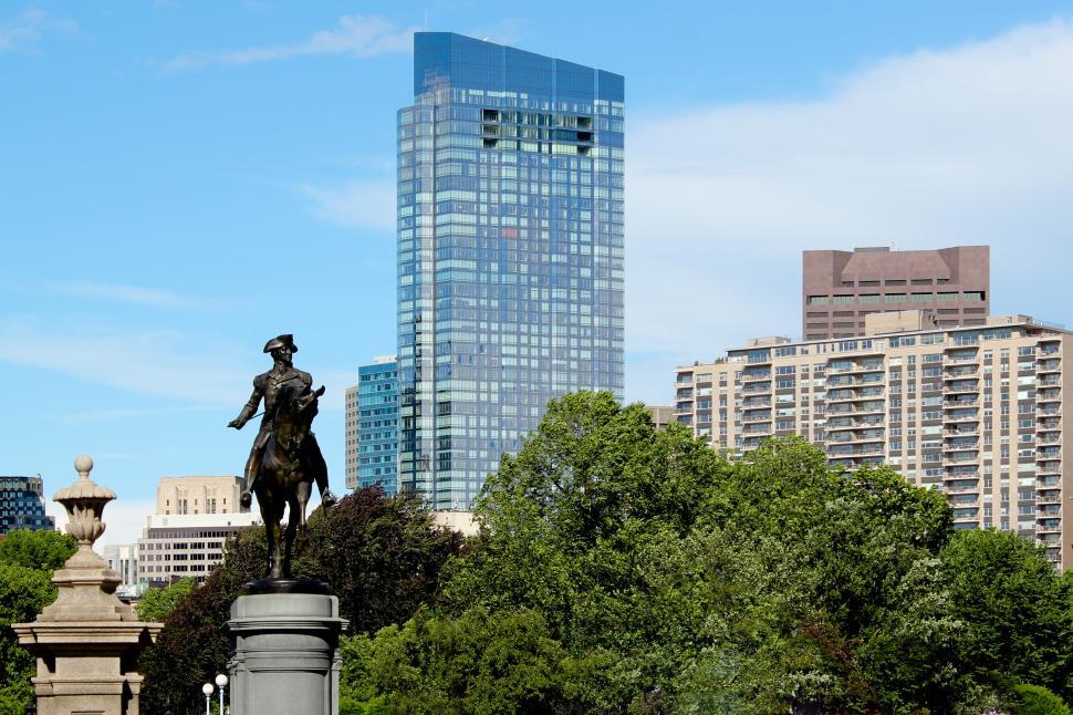 Free Image of Statue of George Washington in Boston Public Garden with modern buildings 