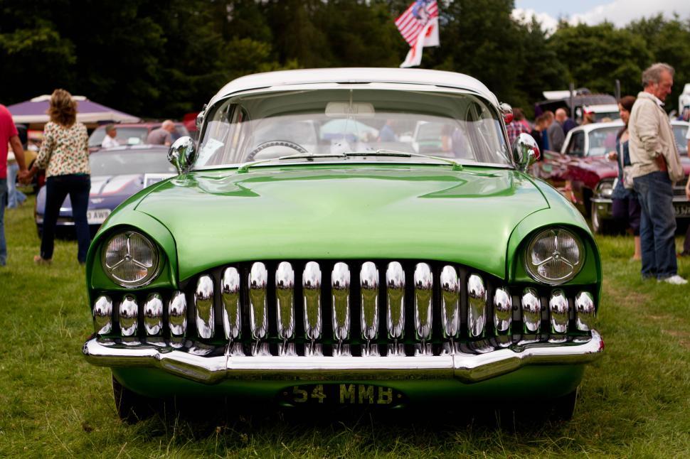Free Image of Classic green car on display at vintage vehicle show in summer 