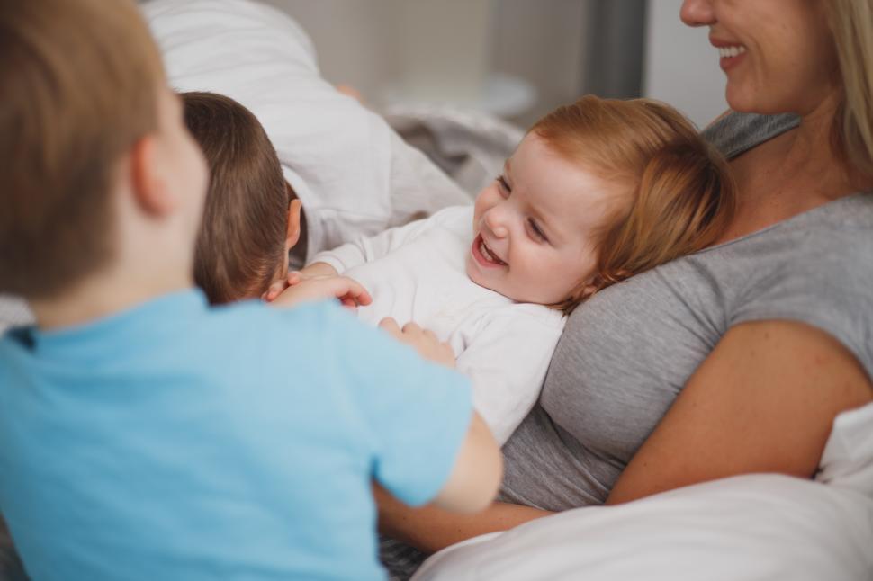 Free Image of Family bonding time with laughter and joy at home during morning 