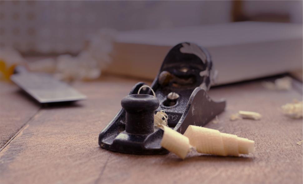 Free Image of Craftsmanship in woodworking with hand plane on wood 