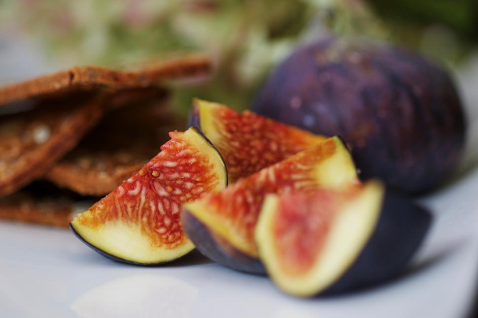 Free Image of Fresh figs and crispy snacks on a white table 