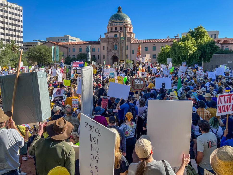 Free Image of No kings protest gathering in the city center with large crowd and signs 