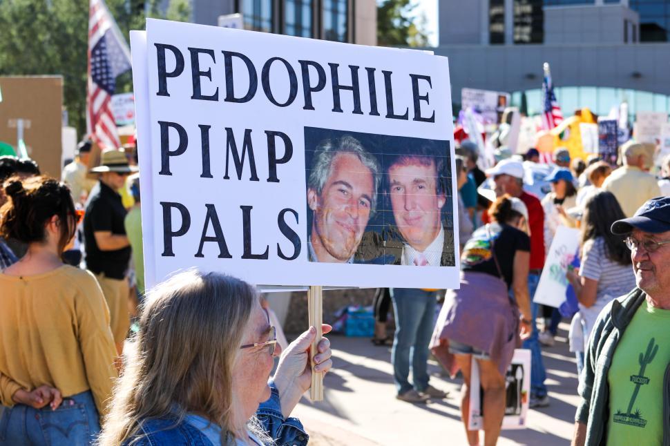 Free Image of Protesters call for justice with signs at a rally against child exploitation 
