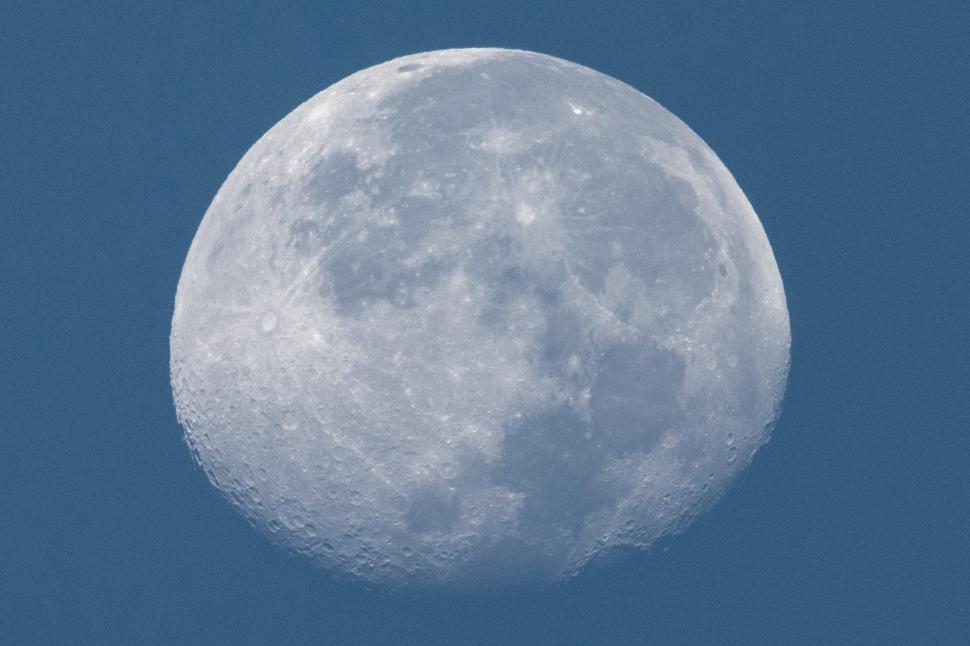 Free Image of Moon illuminated in clear night sky over tranquil landscape 