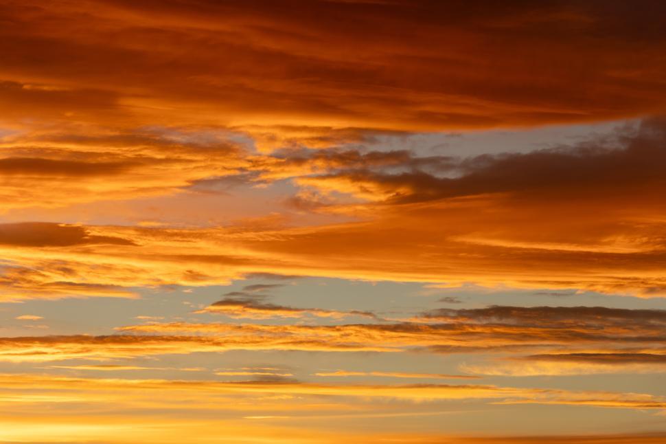 Free Image of Vibrant sunset sky showcases rich orange and blue colors 