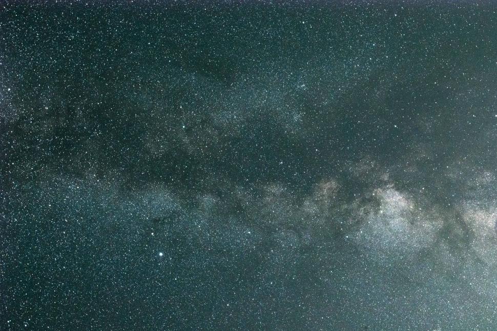 Free Image of Starry night sky view over a peaceful landscape 