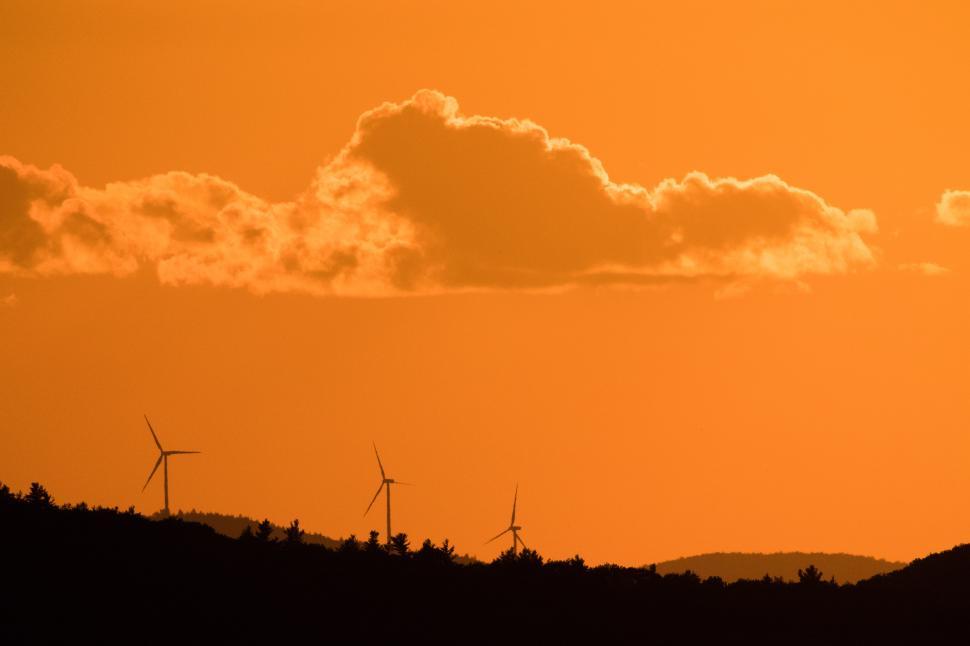 Free Image of Beautiful sunset over wind turbines in the countryside 