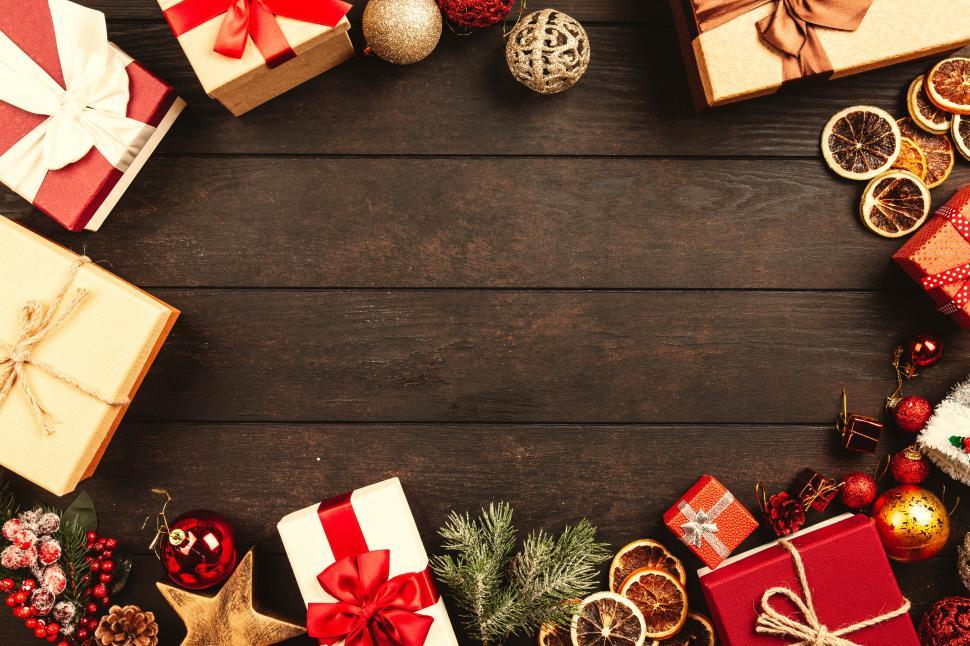 Free Image of Christmas gifts and decorations on a wooden table 