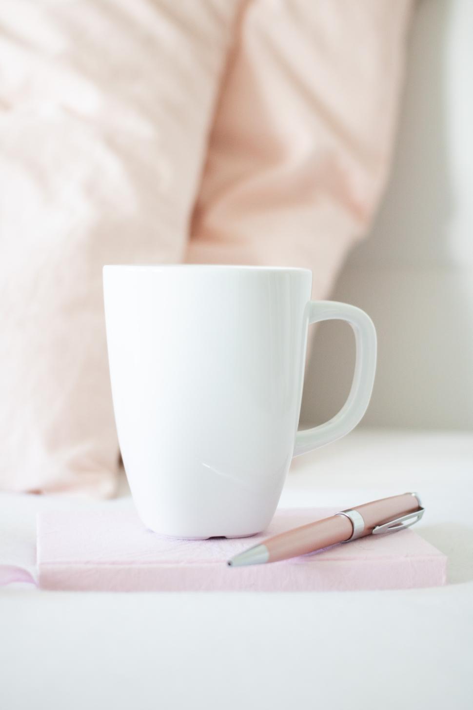Free Image of Warm beverage rests on a cozy surface with soft colors 