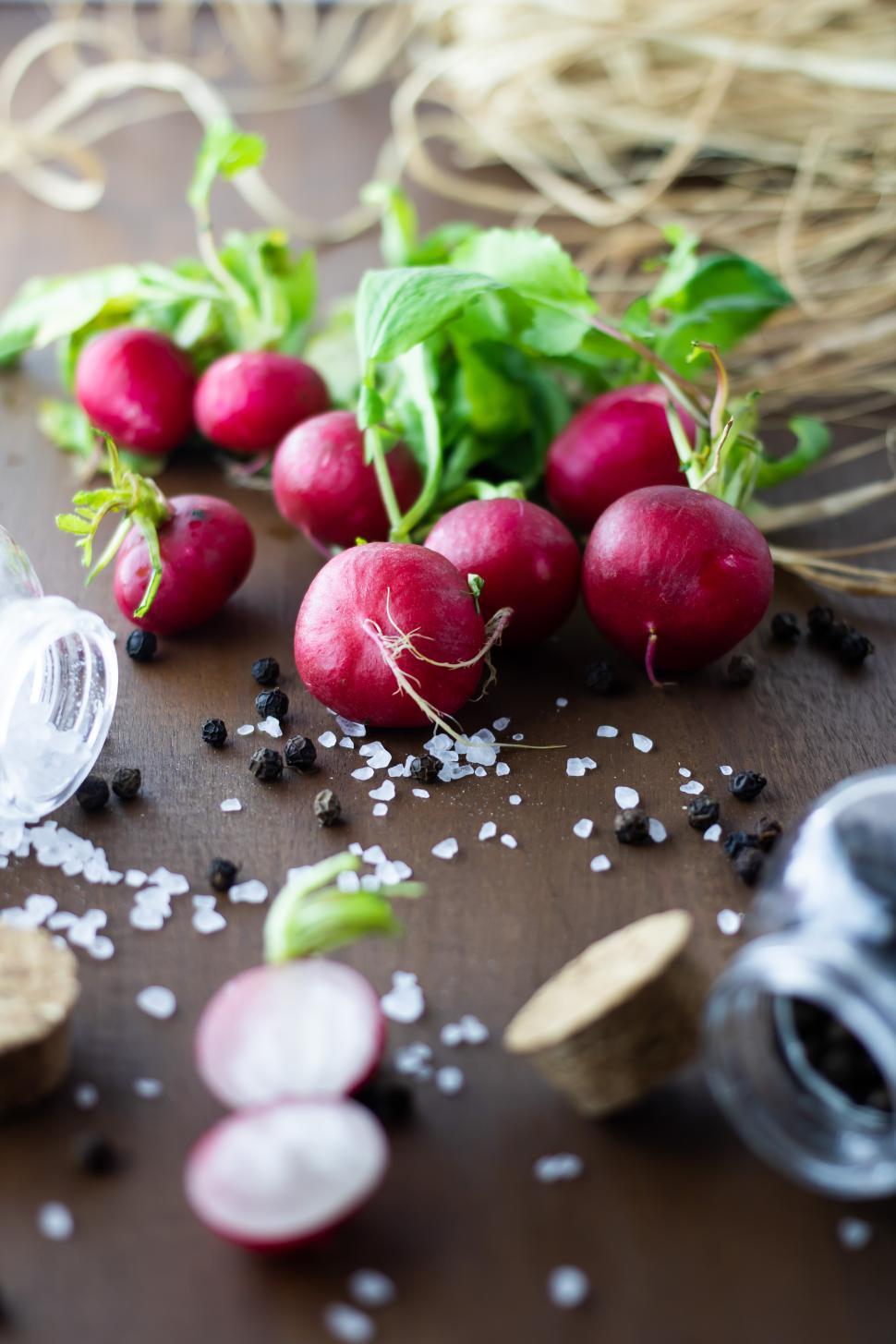 Free Image of Fresh radishes and spices on a wooden table 