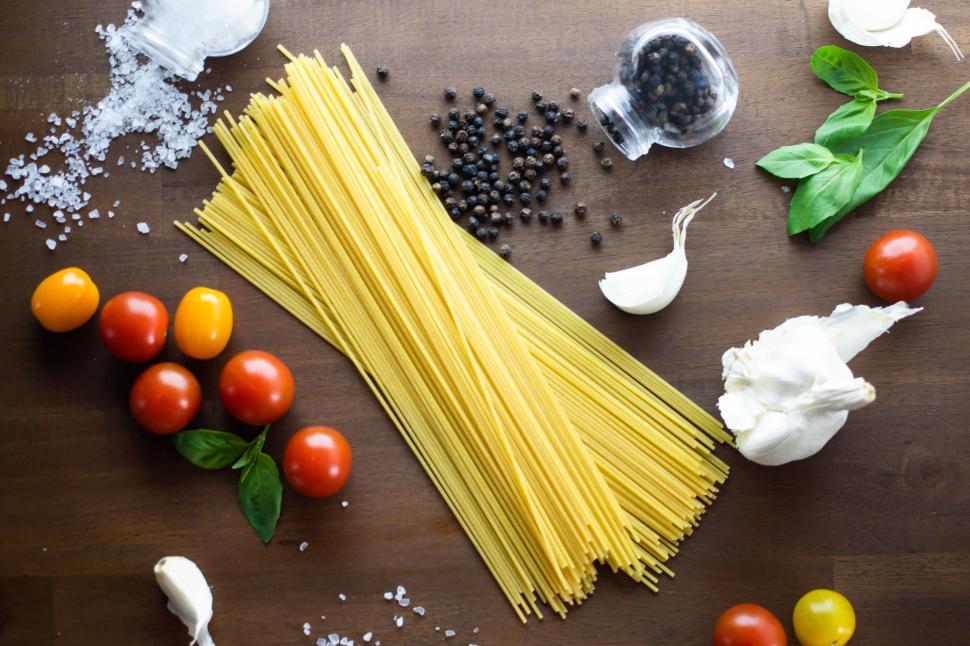Free Image of Pasta preparation with fresh ingredients and spices 