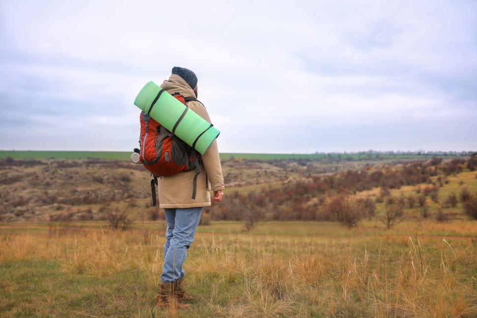 Free Image of Hiker with backpack in a vast landscape 