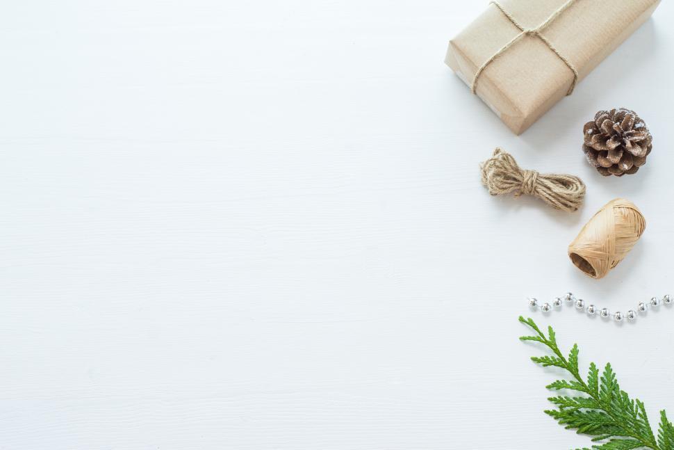 Free Image of Gift wrapping supplies and decorations on a table 