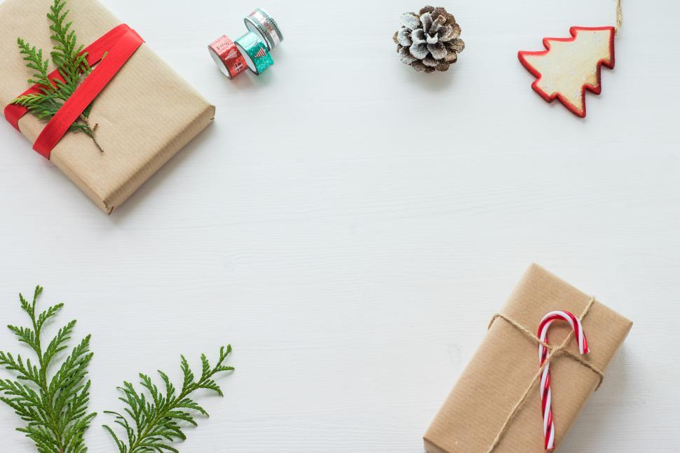 Free Image of Holiday gift arrangement with natural decorations on a white background 