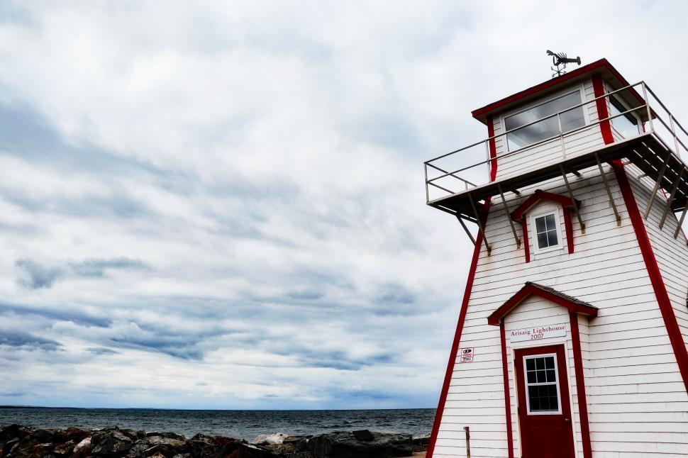 Free Image of Nautical view of a vintage lighthouse near the shore 