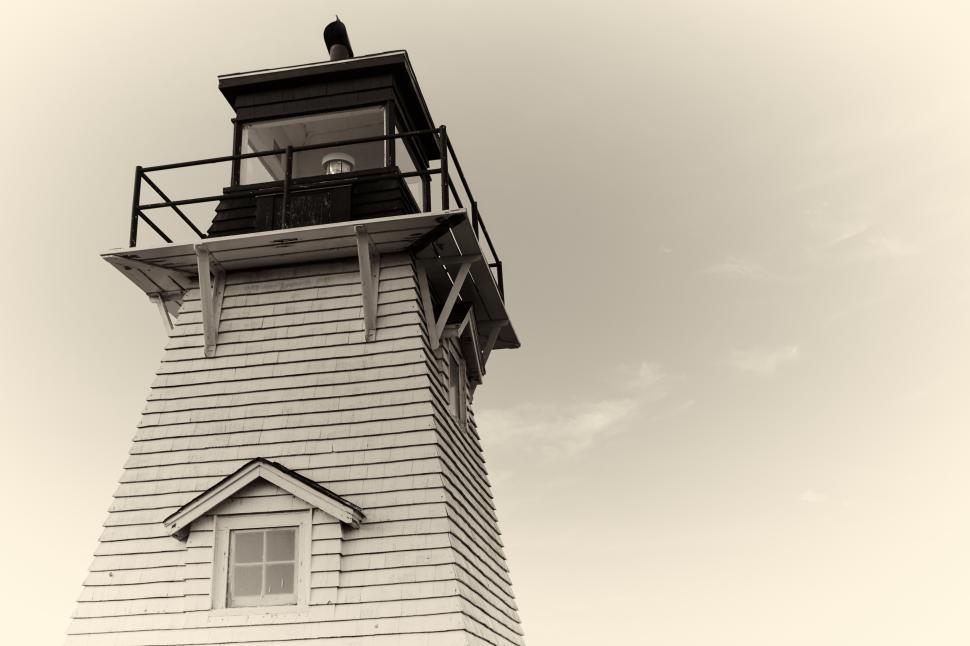 Free Image of Historic lighthouse stands tall against the sky 