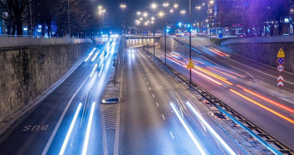 Free Image of Nighttime traffic flows in a bustling urban area 
