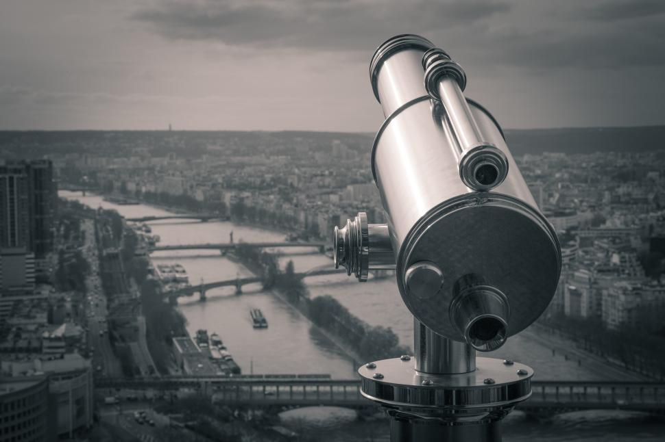 Free Image of Scenic view of Paris skyline with a telescope at sunset 