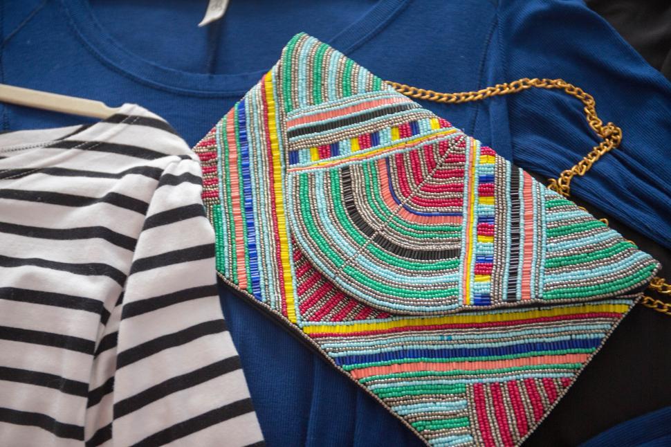Free Image of Fashion accessories and clothing arranged on a flat surface for styling ideas 