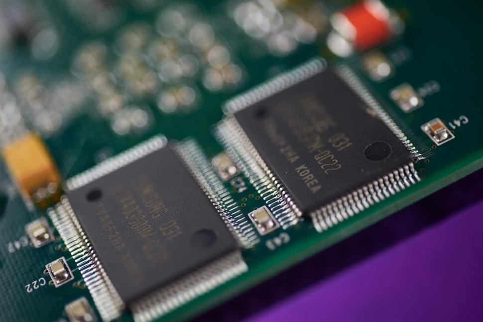 Free Image of Close-up view of microchips on a printed circuit board 