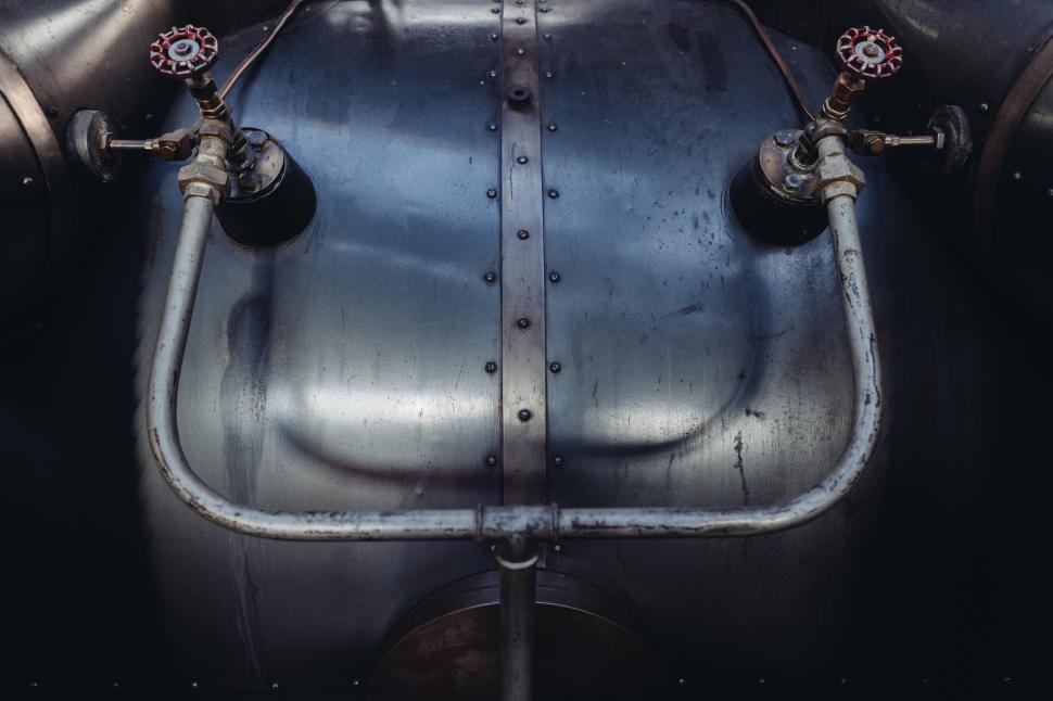 Free Image of Industrial machinery with valves and metal surface details 