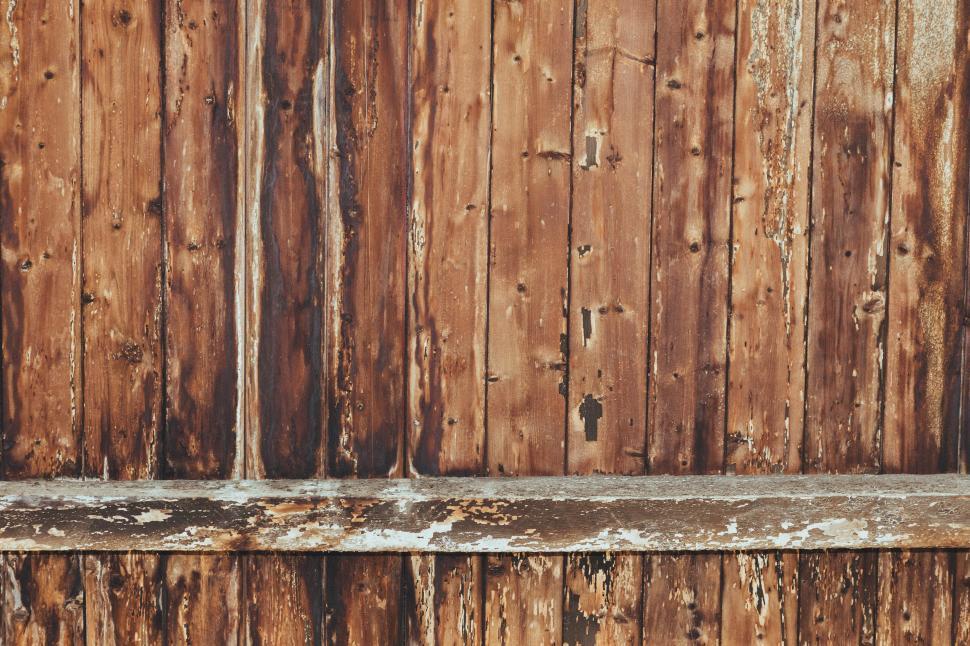 Free Image of Weathered wooden wall with rustic charm and texture 