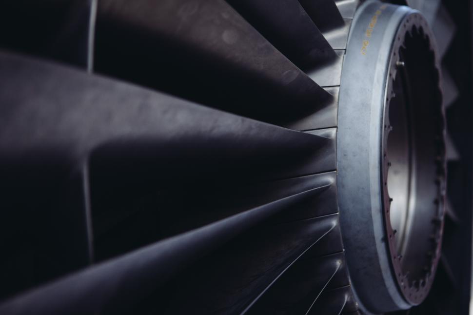 Free Image of Close-up view of a jet engine turbine blade in action 