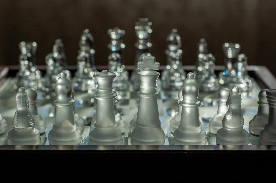 Free Image of Elegant frosted glass chess set displayed indoors 
